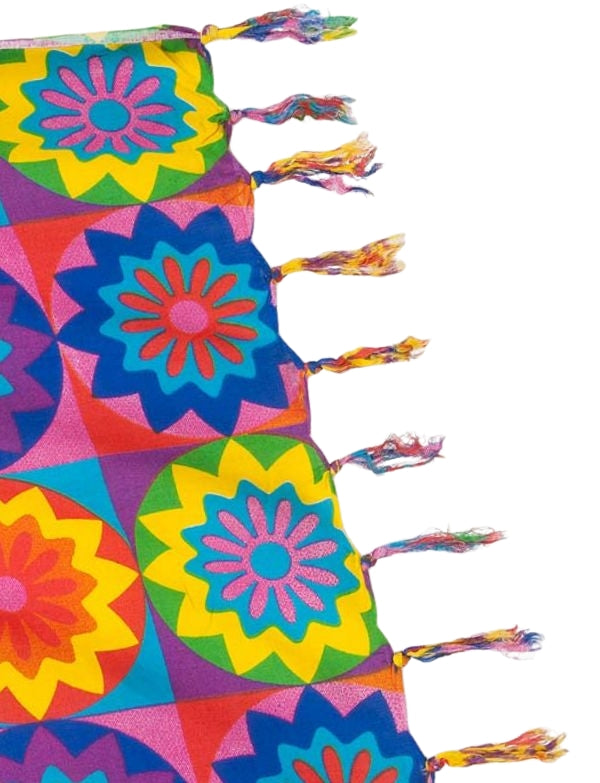 The image shows a sarong featuring a colourful, artistic depiction of a lion's face. Tasseled edge and showcases a vibrant, multicoloured lion design, which adds a unique and eye-catching element.