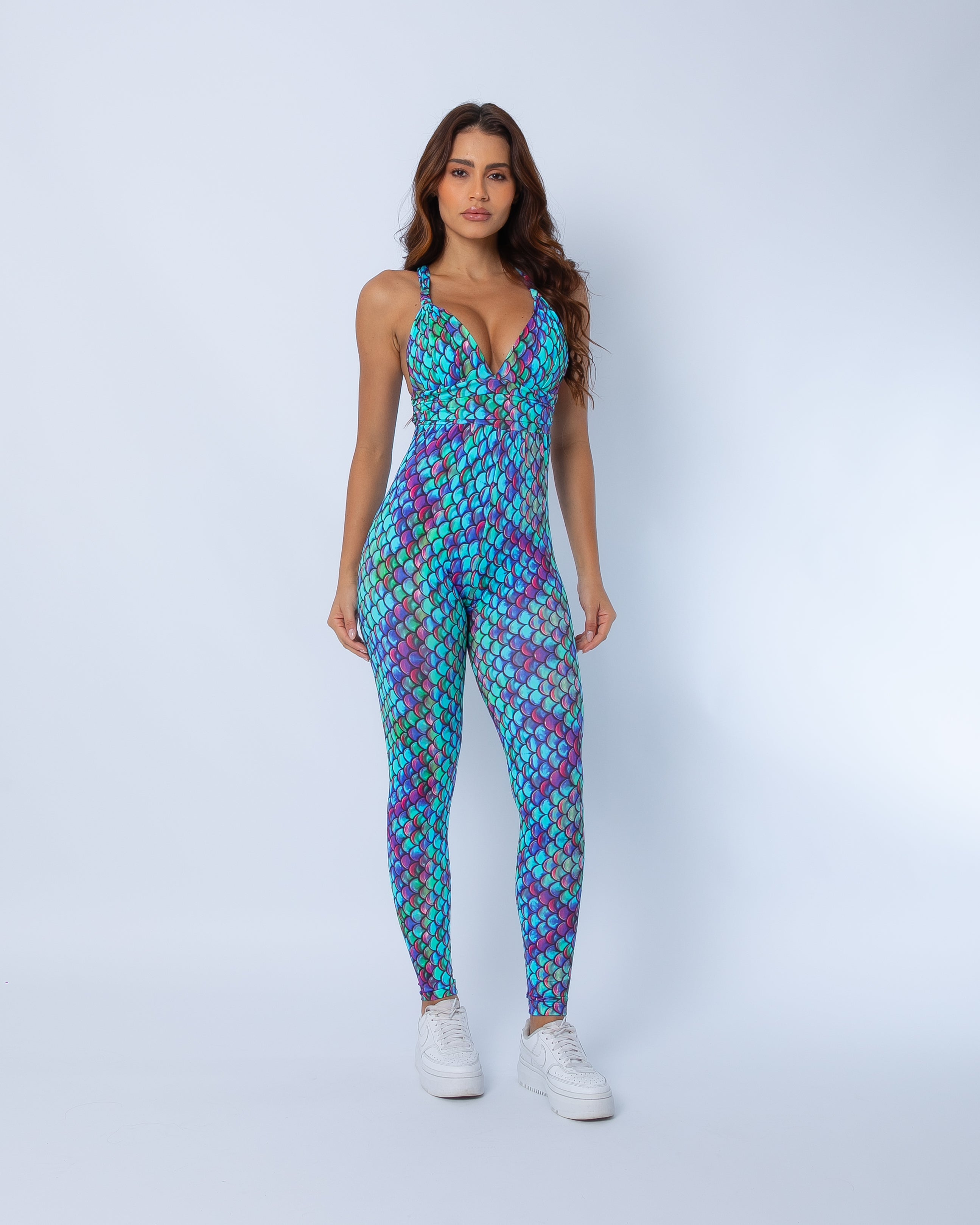 Front view of mermaid print jumpsuit in soft Aqua Swim fabric, fitted design for active or festival wear. 