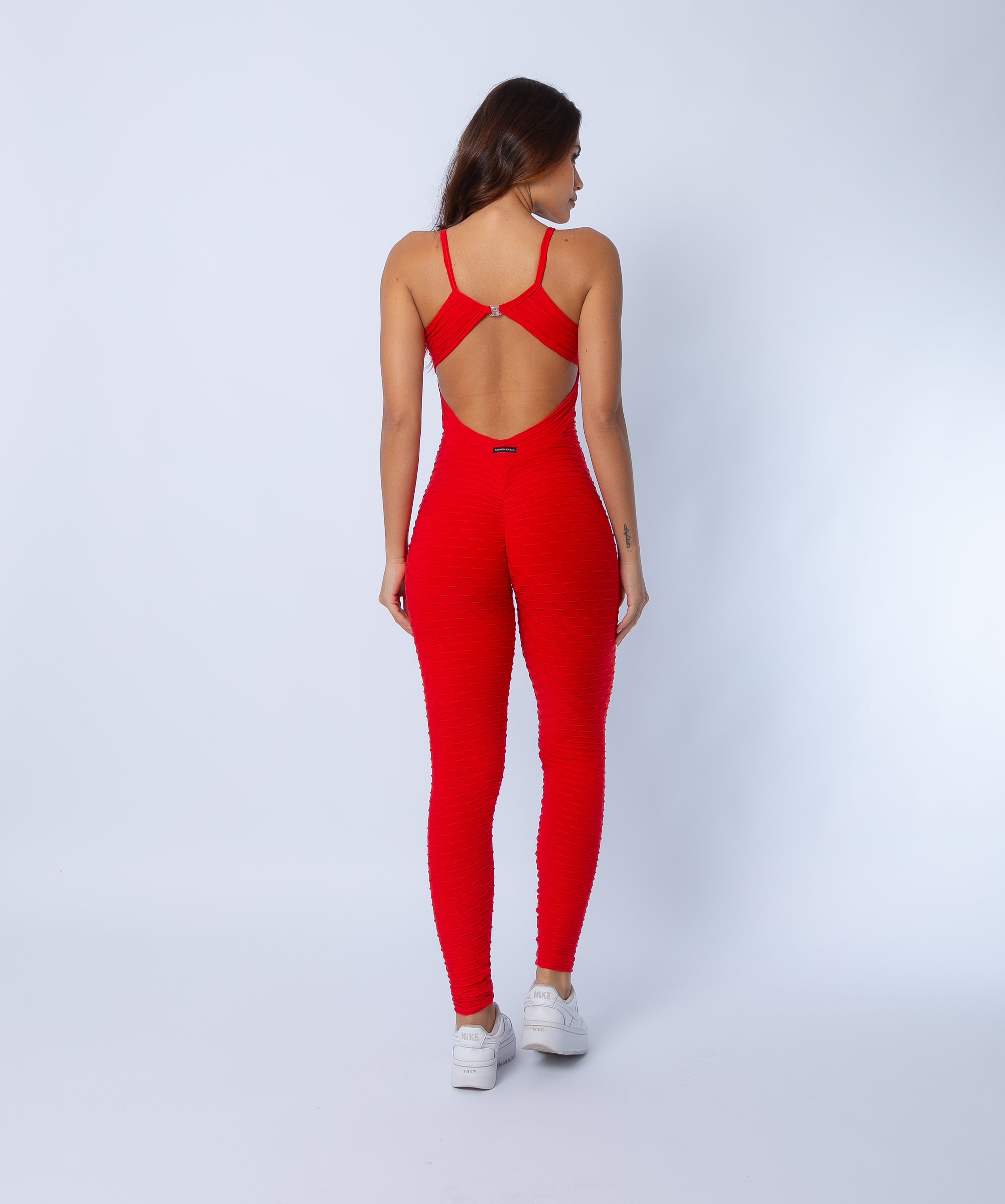 Fashion Brazil Amelia Red Jumpsuit, back view highlighting scrunch-back seam, butt-lift effect, and sculpting full-length design in Zero Flaws textured fabric.
