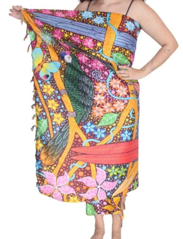 Woman wearing Floresta Sarong as a beach wrap dress, Brazilian birds print on a white background — Fashion Brazil