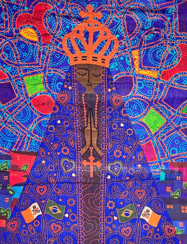 The design is a vibrant, colorful illustration of Nossa Senhora Aparecida, the patroness of Brazil